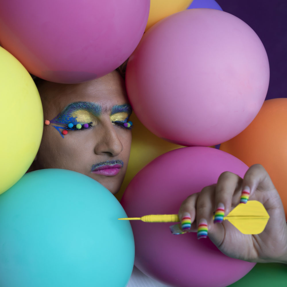 Portrait, Anthonys face is surrounded by colorful ballons